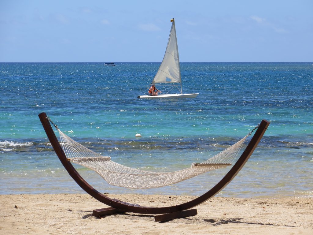 boat out at sea behind hammock