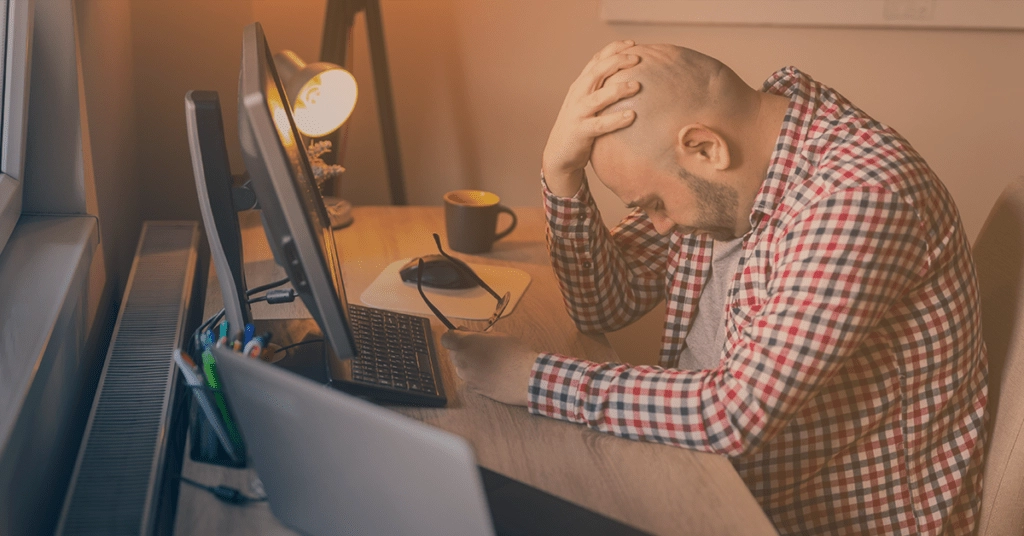 man stressing about money
