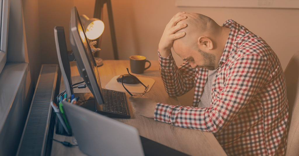 man stressing about money
