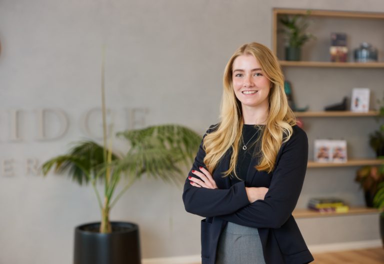 Confident professional woman smiling in modern office