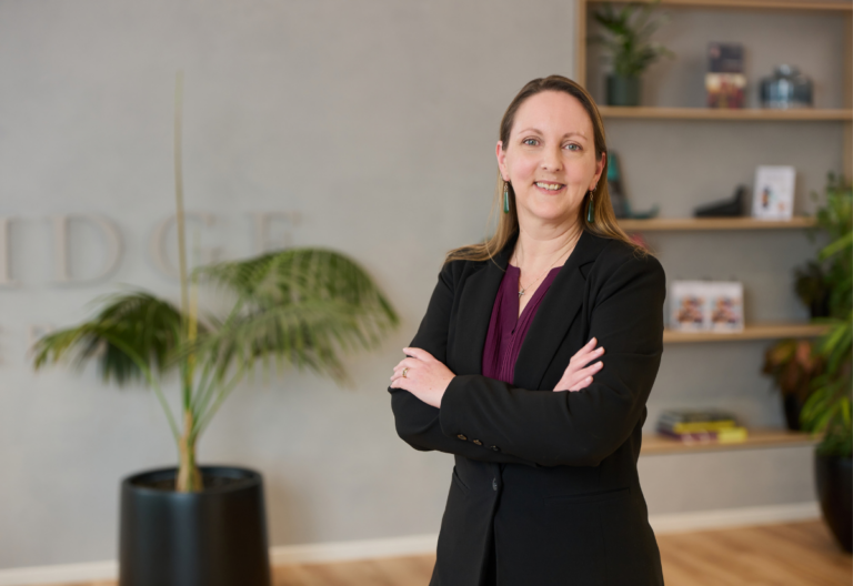 Confident businesswoman standing in modern office space