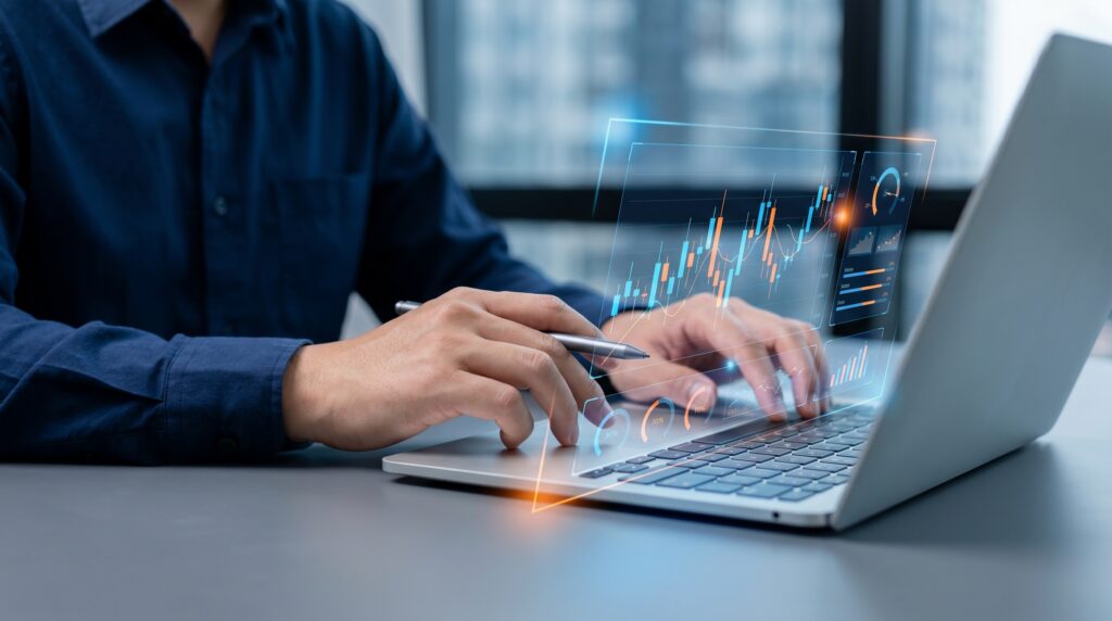 Person analyzing digital financial charts on laptop